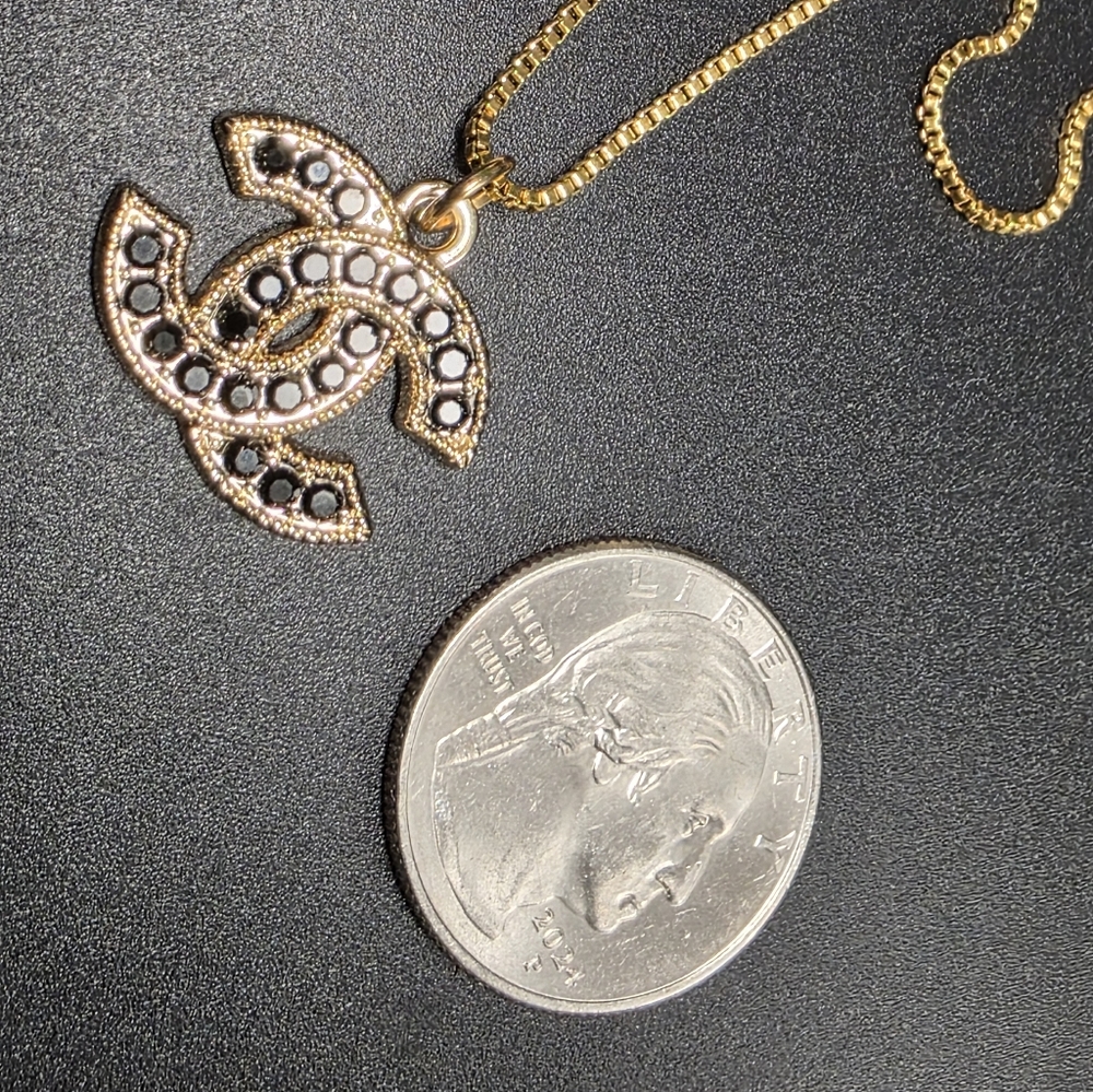 CHANEL Double C Pendant Necklace with Black Stones. 18k PVD Chain
